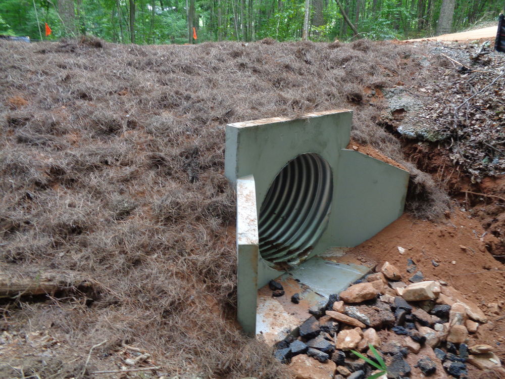 repaired storm strain system: driveway culvert replacement